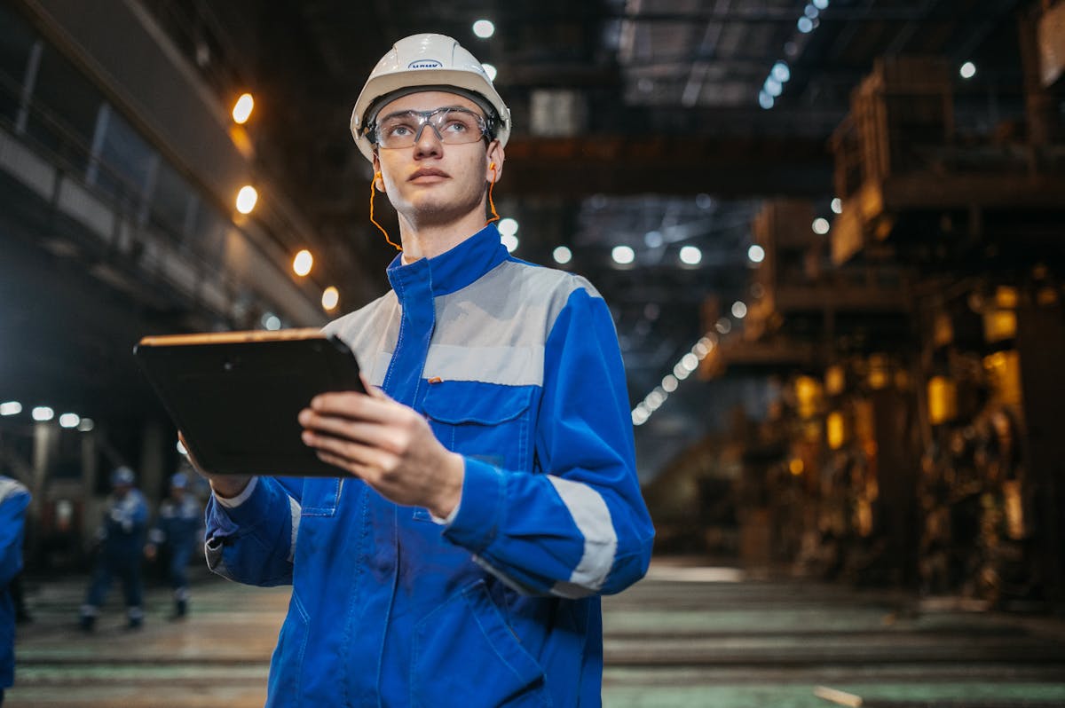 Mine worker using tablet for operational data